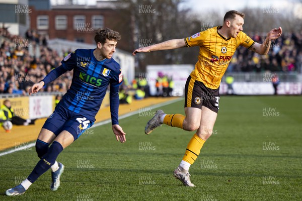 020324 - Newport County v Mansfield Town - Sky Bet League 2 - Luke Jephcott of Newport County in action against Lewis Brunt of Mansfield Town