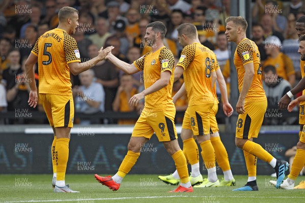 030819 - Newport County v Mansfield Town, Sky Bet League 2 - Padraig Amond of Newport County (2nd left) celebrates scoring his side's second goal with team-mates