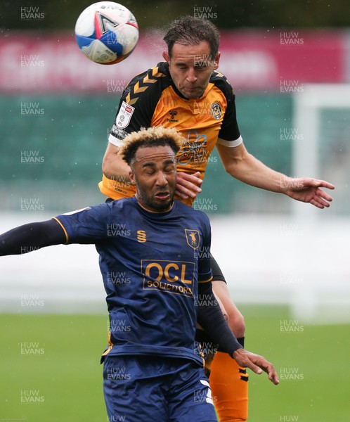 031020 - Newport County v Mansfield Town, Sky Bet League 2 - Matty Dolan of Newport County gets above Nicky Maynard of Mansfield Town to head the ball