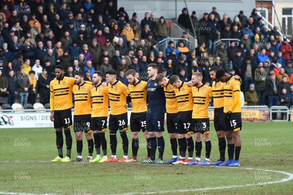 090219 - Newport County v Mansfield Town - Sky Bet League 2 - Newport County players observe a minutes silence for Cardiff City player Emiliano Sala 