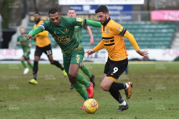 090219 - Newport County v Mansfield Town - Sky Bet League 2 -  Padraig Amond of Newport County holds off Krystian Pearce of Mansfield Town