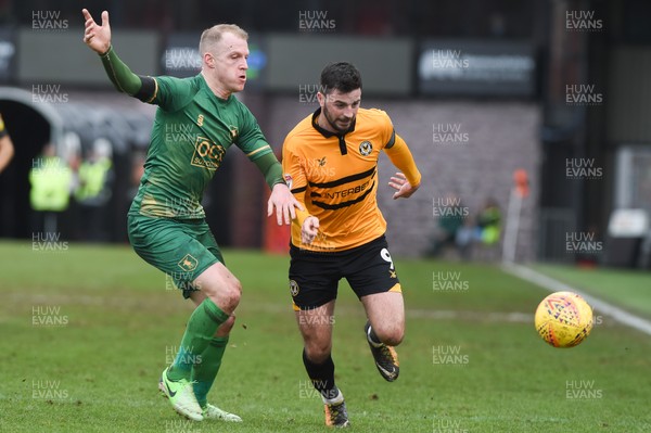 090219 - Newport County v Mansfield Town - Sky Bet League 2 -  Padraig Amond of Newport County beats Neal Bishop of Mansfield Town