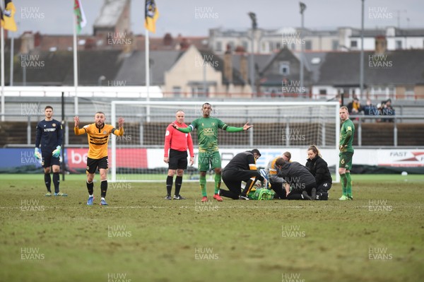 090219 - Newport County v Mansfield Town - Sky Bet League 2 -  Dan Butler of Newport County and Neal Bishop of Mansfield Town plead for a stretcher after an injury to Danny Rose of Mansfield Town