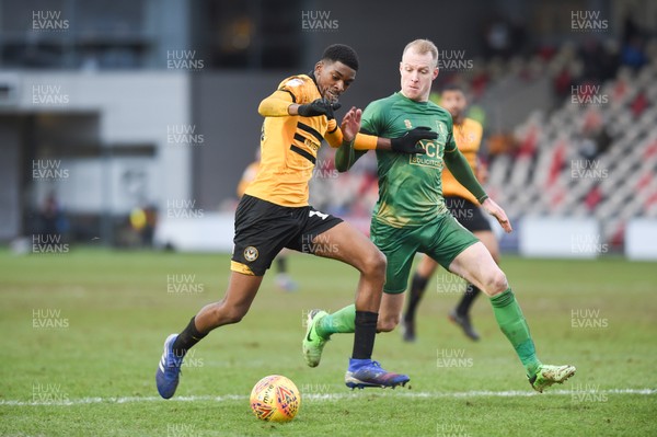 090219 - Newport County v Mansfield Town - Sky Bet League 2 - Tyreeq Bakinson of Newport County holds off Neal Bishop of Mansfield Town