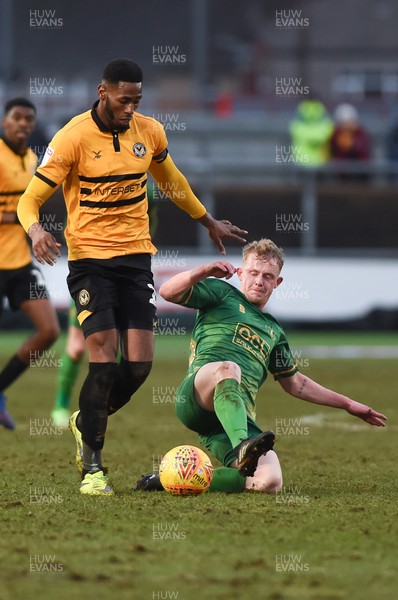 090219 - Newport County v Mansfield Town - Sky Bet League 2 -  Jamille Matt of Newport County is tackled by Will Tomkinson of Mansfield Town