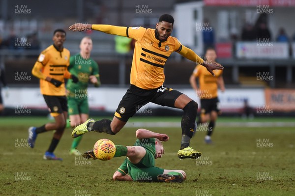 090219 - Newport County v Mansfield Town - Sky Bet League 2 -  Jamille Matt of Newport County is tackled by Will Tomkinson of Mansfield Town
