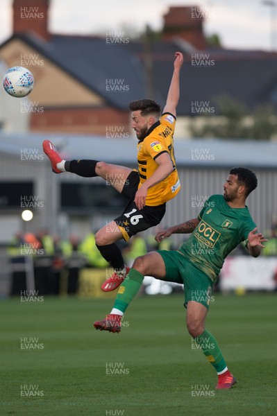090519 - Newport County v Mansfield Town - Sky Bet League 2 - Play Off 1st Leg - Josh Sheehan of Newport County beats Jacob Mellis of Mansfield Town to the ball 