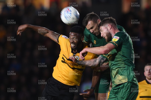 090519 - Newport County v Mansfield Town - Sky Bet League 2 - Play Off 1st Leg -  Jamille Matt of Newport County and Ben Turner of Mansfield Town and Ryan Sweeney of Mansfield Town compete for the ball 
