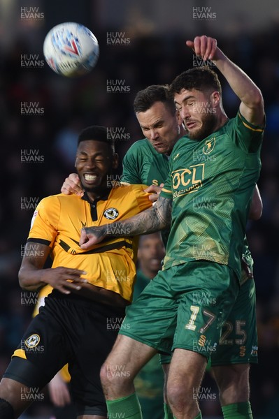 090519 - Newport County v Mansfield Town - Sky Bet League 2 - Play Off 1st Leg -  Jamille Matt of Newport County and Ben Turner of Mansfield Town and Ryan Sweeney of Mansfield Town compete for the ball 