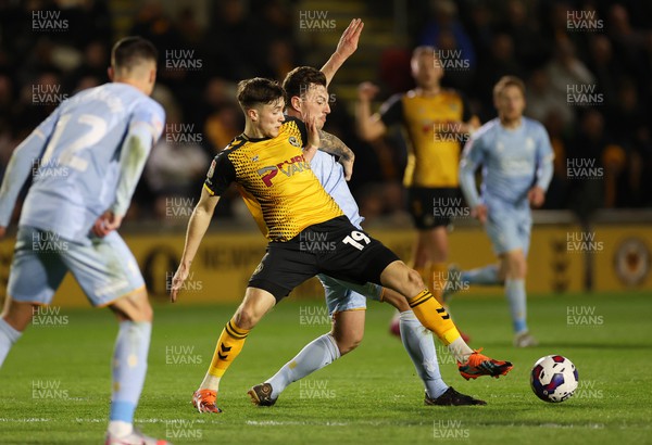 180423 - Newport County v Mansfield Town - SkyBet League Two - Charlie McNeill of Newport County is challenged by Kieran Wallace of Mansfield 