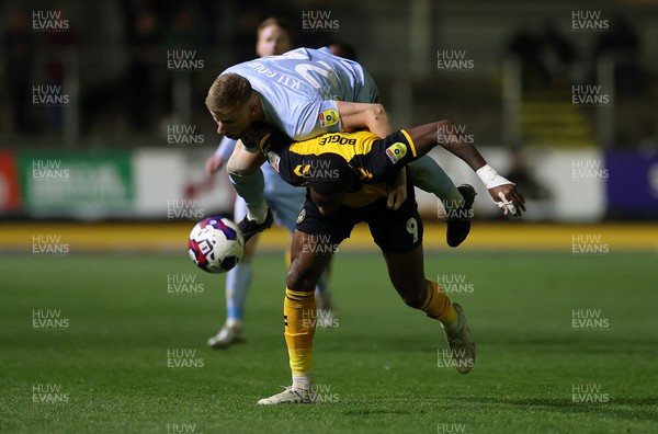 180423 - Newport County v Mansfield Town - SkyBet League Two - Alfie Kilgour of Mansfield goes over Omar Bogle of Newport County 