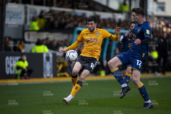 190222 - Newport County v Mansfield Town - Sky Bet League 2 - Oliver Hawkins of Mansfield Town (R) tackles Finn Azaz of Newport County (C)