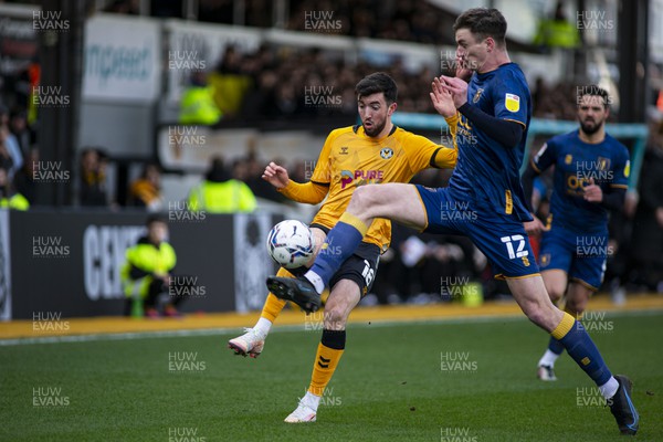 190222 - Newport County v Mansfield Town - Sky Bet League 2 - Oliver Hawkins of Mansfield Town (R) tackles Finn Azaz of Newport County (C)