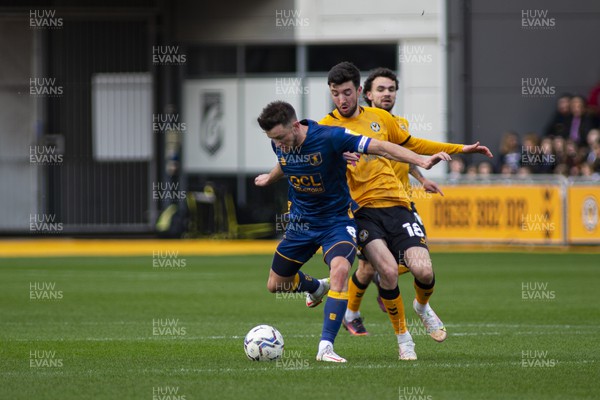190222 - Newport County v Mansfield Town - Sky Bet League 2 - Finn Azaz of Newport County (R) in action against Ollie Clarke of Mansfield Town (L)