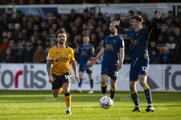 190222 - Newport County v Mansfield Town - Sky Bet League 2 - Dom Telford of Newport County (L) in action against Oliver Hawkins of Mansfield Town (R)