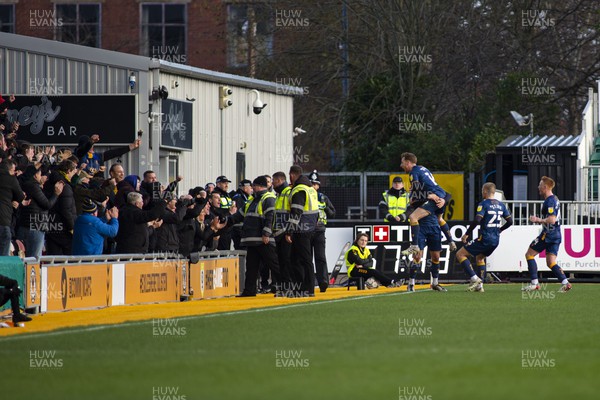190222 - Newport County v Mansfield Town - Sky Bet League 2 - Mansfield Town celebrate their first goal in front of their away fans