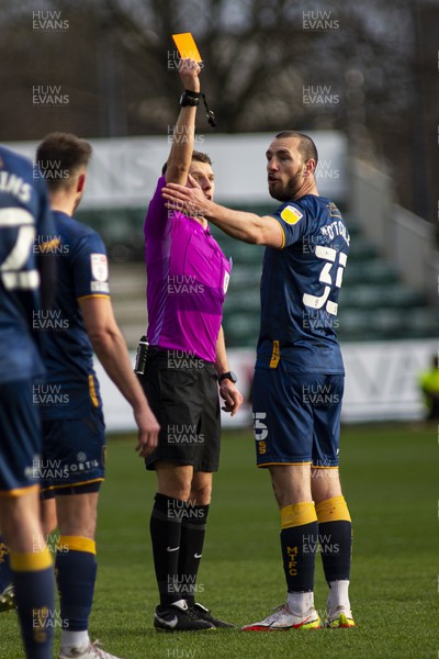 190222 - Newport County v Mansfield Town - Sky Bet League 2 - Referee Will Finnie (L) shows a red card to John-Joe O'Toole of Mansfield Town (R)