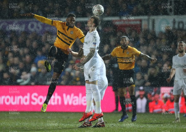 050219 - Newport County v Middlesbrough, FA Cup Round 4 Replay - Jamille Matt of Newport County beats Aden Flint of Middlesbrough to head the ball