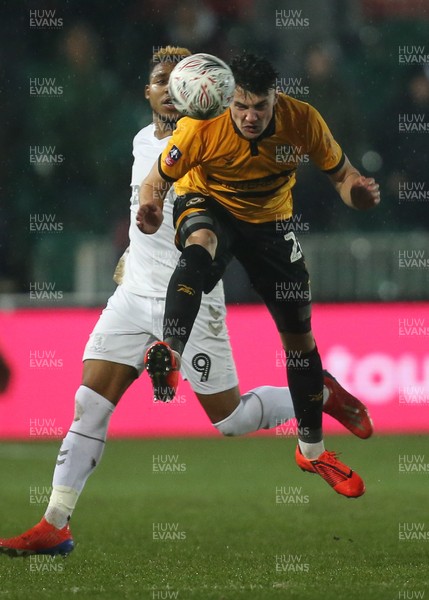 050219 - Newport County v Middlesbrough, FA Cup Round 4 Replay - Regan Poole of Newport County gets the ball away from Britt Assombalonga of Middlesbrough