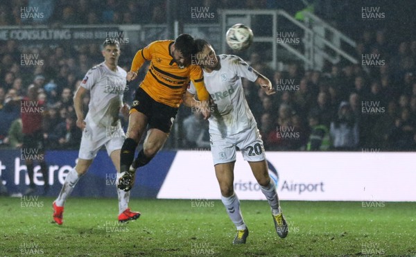 050219 - Newport County v Middlesbrough, FA Cup Round 4 Replay - Padraig Amond of Newport County heads at goal as Dael Fry of Middlesbrough challenges