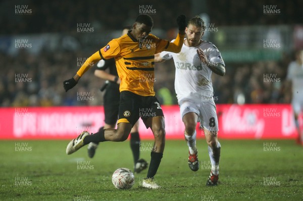 050219 - Newport County v Middlesbrough, FA Cup Round 4 Replay - Tyreeq Bakinson of Newport County fires a shot at goal as Adam Clayton of Middlesbrough closes in