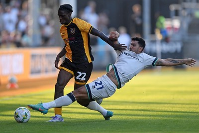 120825 - Newport County v Millwall - Carabao Cup Round 1 - Habeeb Ogunneye of Newport County is challenged by Massimo Luongo of Millwall