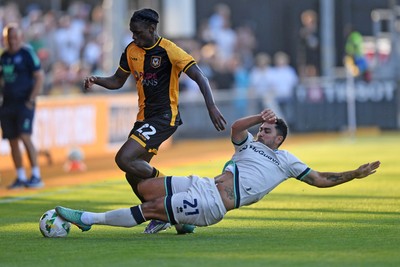 120825 - Newport County v Millwall - Carabao Cup Round 1 - Habeeb Ogunneye of Newport County is challenged by Massimo Luongo of Millwall