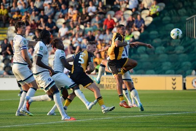 120825 - Newport County v Millwall - Carabao Cup Round 1 - James Clarke of Newport County heads at goal