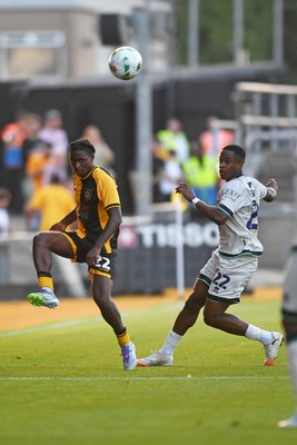 120825 - Newport County v Millwall - Carabao Cup Round 1 - Habeeb Ogunneye of Newport County is challenged by Aidomo Emakhu of Millwall