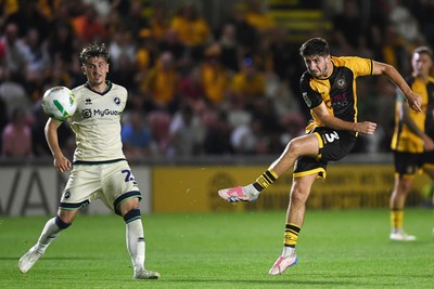 120825 - Newport County v Millwall - Carabao Cup Round 1 - Anthony Glennon of Newport County has a shot from distance