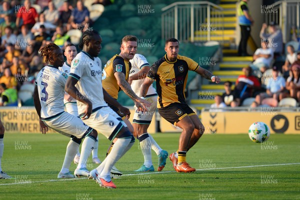 120825 - Newport County v Millwall - Carabao Cup Round 1 - James Clarke of Newport County watches the ball as he heads it on target