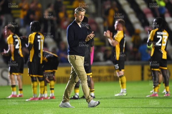 120825 - Newport County v Millwall - Carabao Cup Round 1 - Newport County Manager, David Hughes applauding the fans support at full time