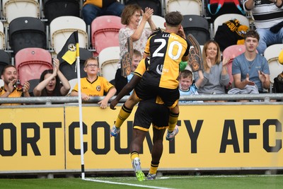 230825 - Newport County v Milton Keynes Dons - Sky Bet League 2 - Habeeb Ogunneye of Newport County scores the first goal of the game and celebrates with Ben Lloyd of Newport County