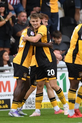 230825 - Newport County v Milton Keynes Dons - Sky Bet League 2 - Habeeb Ogunneye of Newport County scores the first goal of the game and celebrates with Ben Lloyd of Newport County