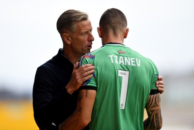 230825 - Newport County v Milton Keynes Dons - Sky Bet League 2 - Newport County Manager, David Hughes with Nik Tzanev of Newport County before the match