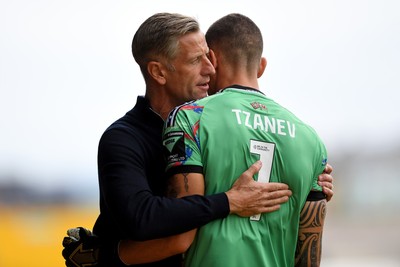 230825 - Newport County v Milton Keynes Dons - Sky Bet League 2 - Newport County Manager, David Hughes with Nik Tzanev of Newport County before the match