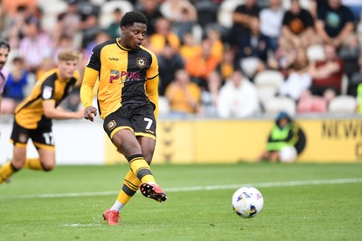 230825 - Newport County v Milton Keynes Dons - Sky Bet League 2 - Bobby Kamwa of Newport County has his penalty saved by Craig MacGillivray of MK Dons
