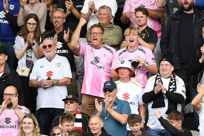 230825 - Newport County v Milton Keynes Dons - Sky Bet League 2 - MK Fans after Craig MacGillivray of MK Dons saves a penalty