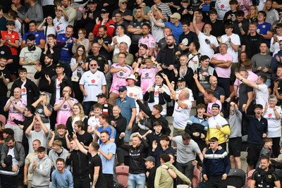 230825 - Newport County v Milton Keynes Dons - Sky Bet League 2 - MK Fans after Craig MacGillivray of MK Dons saves a penalty