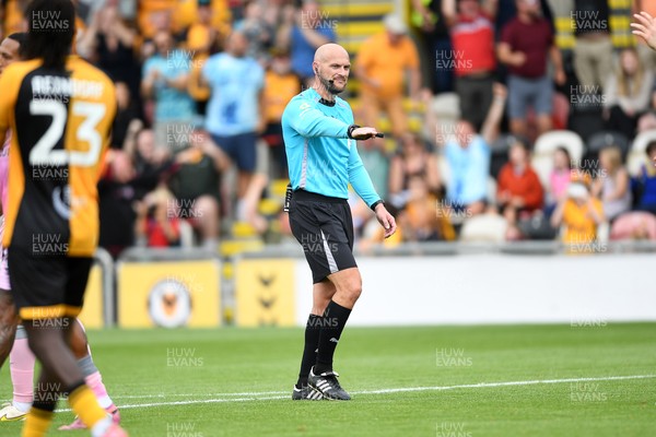 230825 - Newport County v Milton Keynes Dons - Sky Bet League 2 - Referee, Stuart Morland awards a penalty to Newport