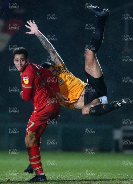 070120 - Newport County v MK Dons - Leasingcom Trophy - Ryan Innis of Newport County crashes over the top of Sam Nombe of MK Dons