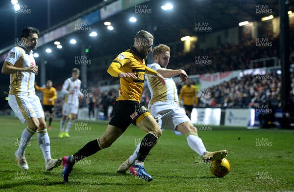 120219 - Newport County v MK Dons - SkyBet League 2 - Dan Butler of Newport County and Dean Lewington of MK Dons compete