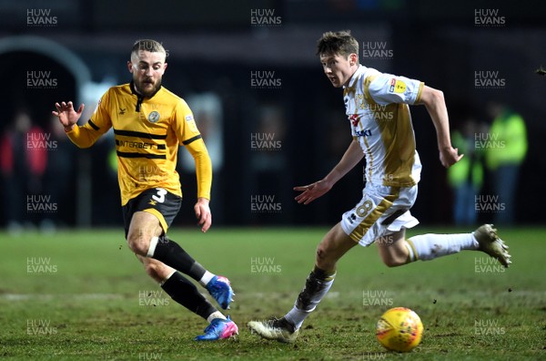 120219 - Newport County v MK Dons - SkyBet League 2 - Dan Butler of Newport County is challenged by Conor McGrandles of MK Dons