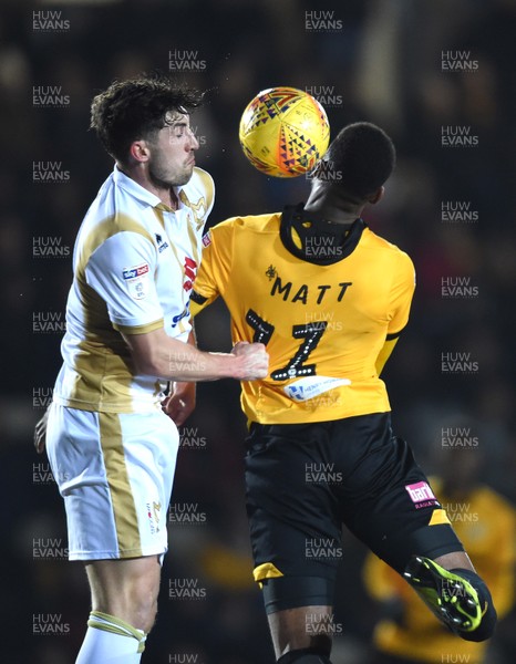 120219 - Newport County v MK Dons - SkyBet League 2 - Jamille Matt of Newport County is tackled by Joe Walsh of MK Dons