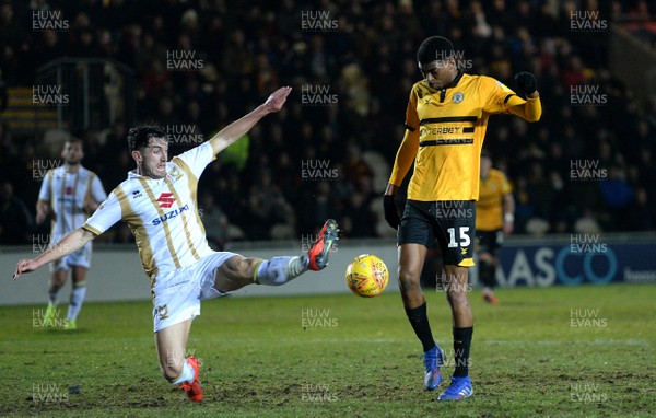120219 - Newport County v MK Dons - SkyBet League 2 - Tyreeq Bakinson of Newport County is tackled by Joe Walsh of MK Dons