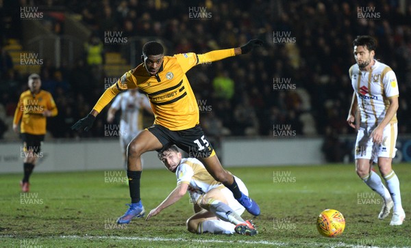 120219 - Newport County v MK Dons - SkyBet League 2 - Tyreeq Bakinson of Newport County is tackled by Joe Walsh of MK Dons