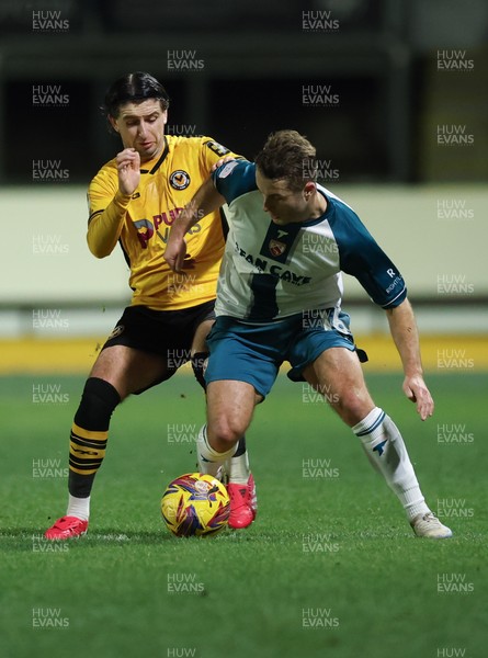 040225  Newport County v Morecambe, EFL Sky Bet League 2 - Anthony Glennon of Newport County and Andrew Dallas of Morecambe compete for the ball