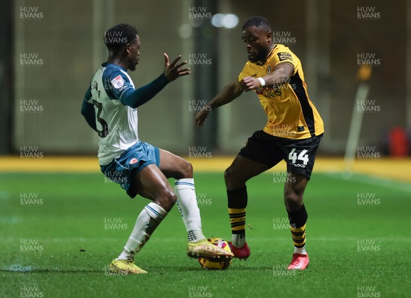 040225  Newport County v Morecambe, EFL Sky Bet League 2 - David Ajiboye of Newport County is brought down by David Tutonda of Morecambe