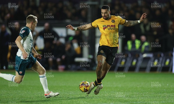 040225  Newport County v Morecambe, EFL Sky Bet League 2 - Courtney Baker-Richardson of Newport County looks to shoot at goal as Luke Hendrie of Morecambe closes in