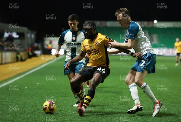 040225  Newport County v Morecambe, EFL Sky Bet League 2 - David Ajiboye of Newport County holds off Adam Lewis of Morecambe and Luke Hendrie of Morecambe